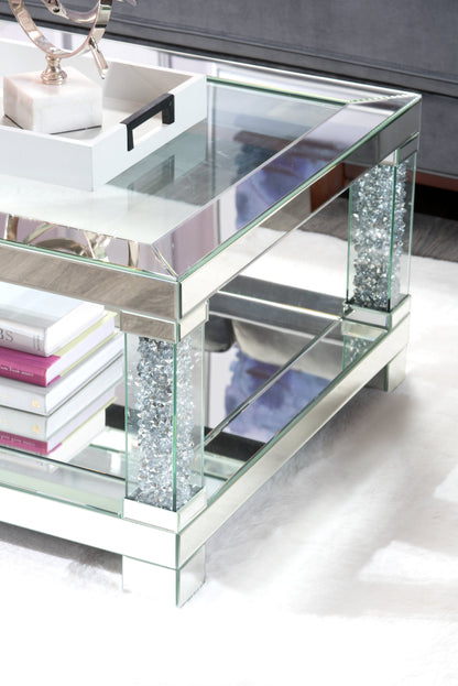 Berni 47.2" Glam Mirror & Glass Top Coffee Table with Shelf - Silver Metal with Diamond Look Legs|Table à café somptueuse Berni de 47,2 po avec dessus en miroir et en verre et tablette - métal argenté avec pattes à apparence de diamant