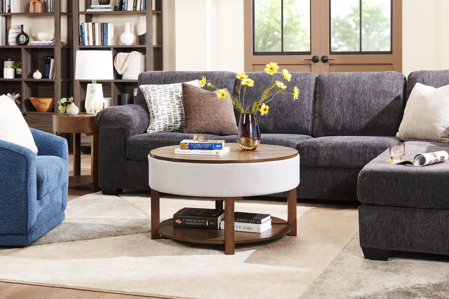 Elroy 33" Rustic Round Lift Top Coffee Table With Storage, Shelf and Casters - Brown and Grey with Fabric Edge|Table à café ronde rustique Elroy de 33 po avec dessus relevable, rangement, tablette et roulettes - brune et grise avec bordure en tissu